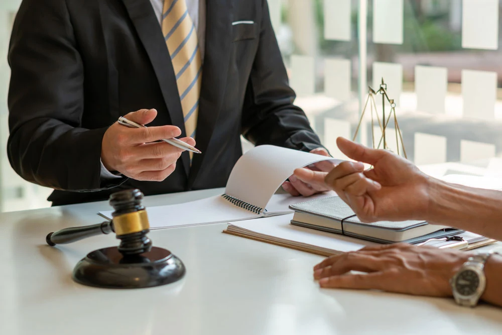 businesspeople consult with a lawyer