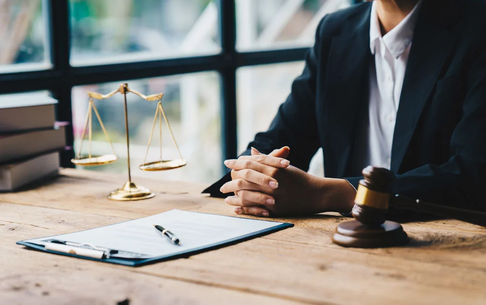 Businessman in suit or lawyer working on a documents