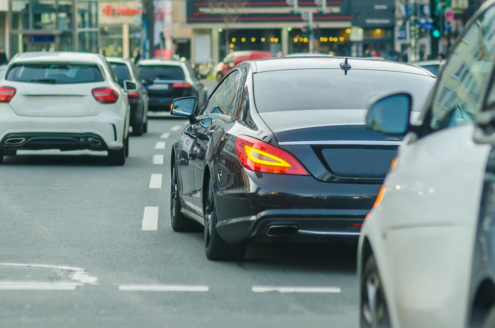 Business car in traffic on the road