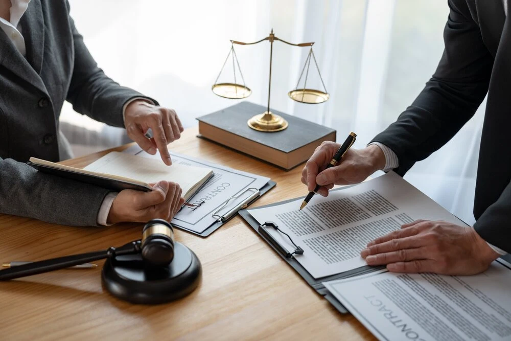 Lawyer, legal advisor, businessman brainstorming information on agreement details
